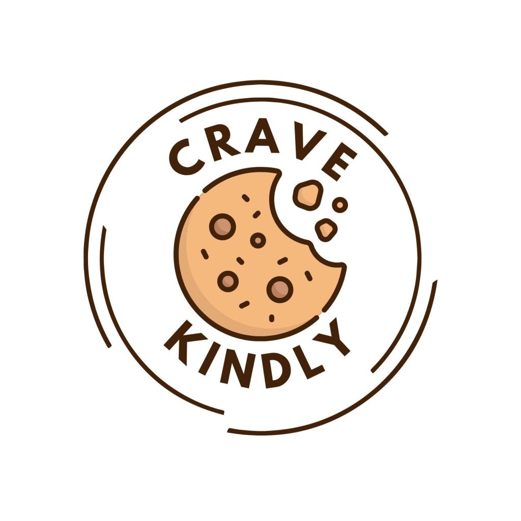Crave Kindly logo, a Survivor Zone vendor at Haunted Hall of Terror 2026. The logo depicts a bitten chocolate chip cookie inside a circular badge and bold lettering, representing a Niceville bakery offering vegan and plant-based cookies and sweet treats.